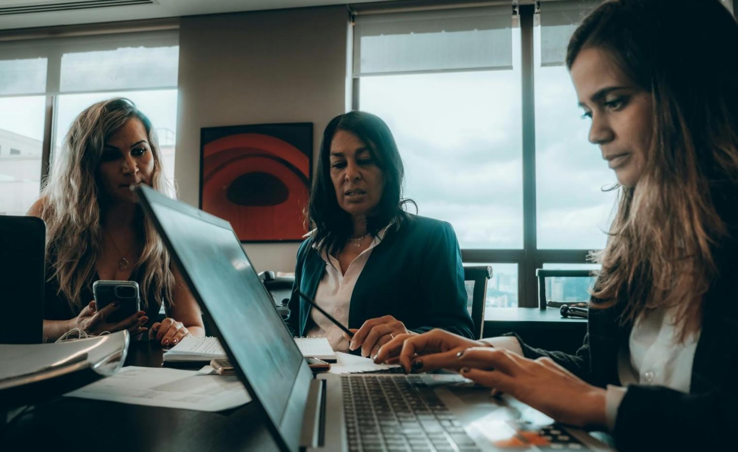 Business owner reviewing financial reports at desk